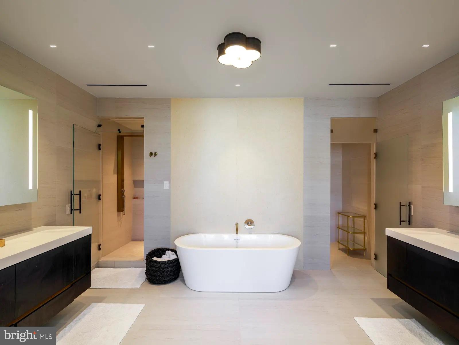 1401 Spruce Street, Unit PHF Philadelphia, PA 19102 - Photo 5 of 5 a spacious bathroom with a double vanity sink tub and a mirror