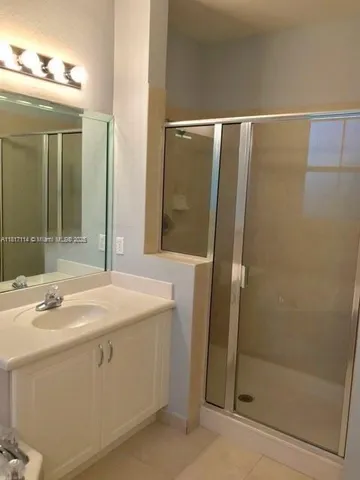a bathroom with a sink and mirror