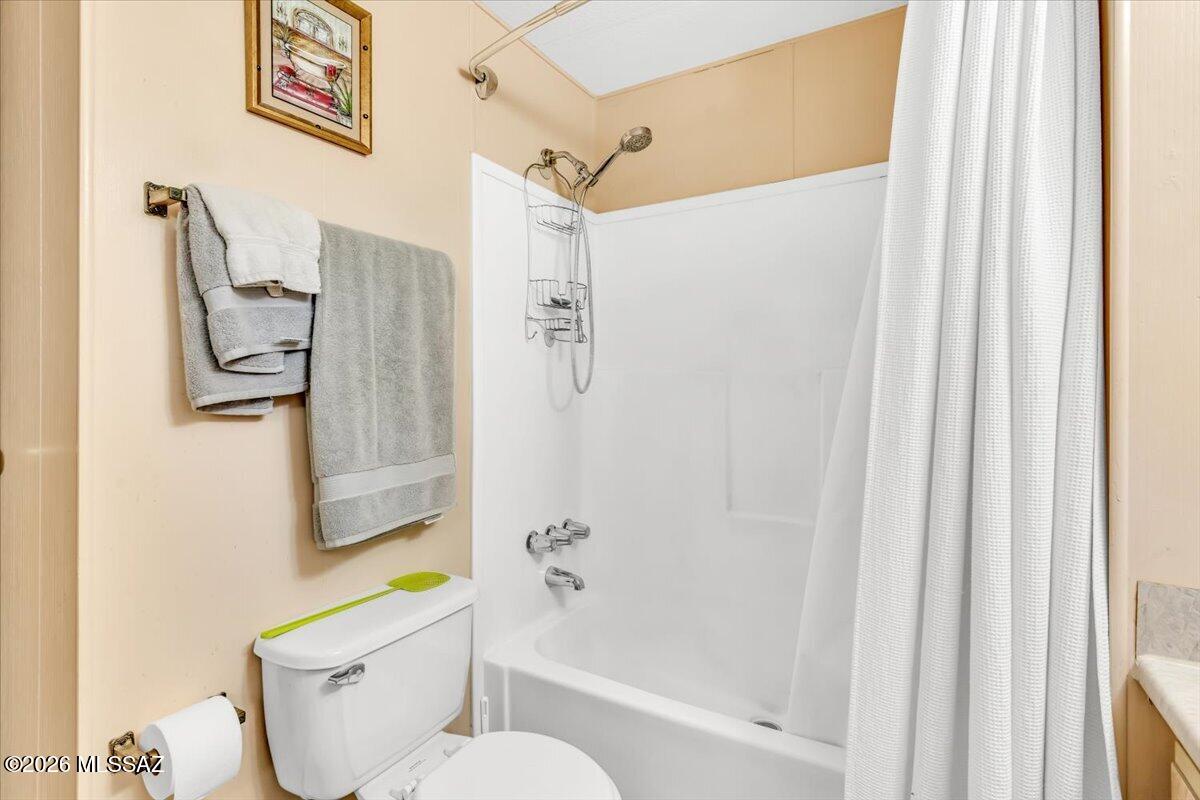 5379 West Rafter Cir Street Tucson, AZ 85713 - Photo 22 of 38 a bathroom with a toilet and a shower