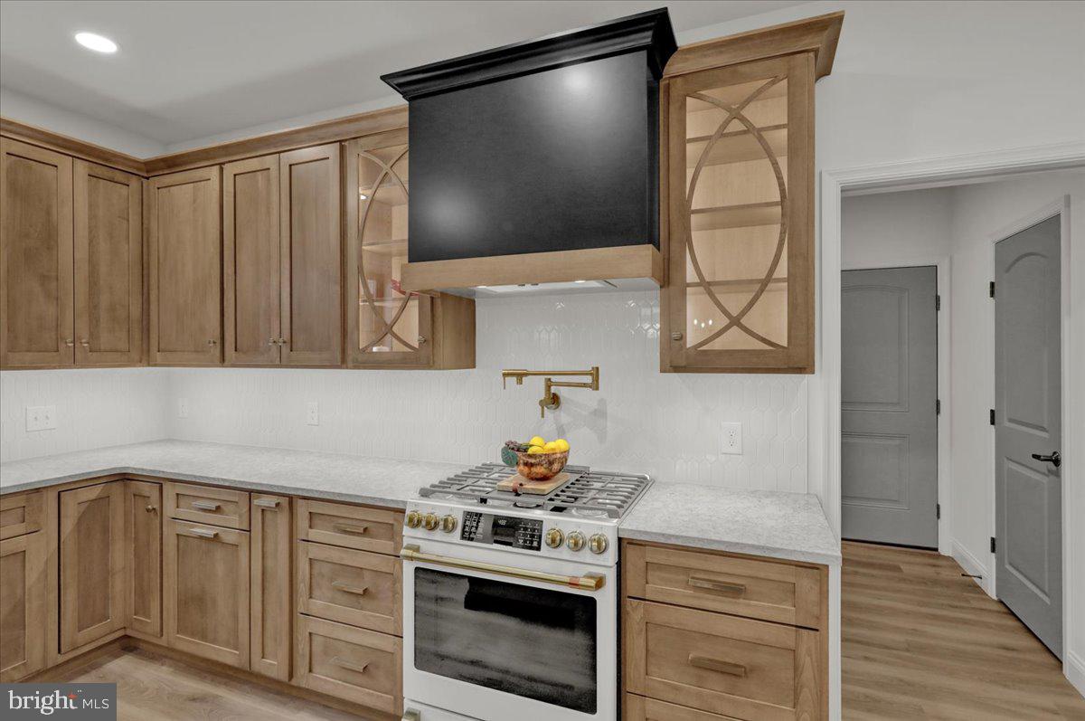 2000 Rolling Meadow Road Lebanon, PA 17046 - Photo 22 of 66 a kitchen with stainless steel appliances granite countertop a stove a sink and a microwave