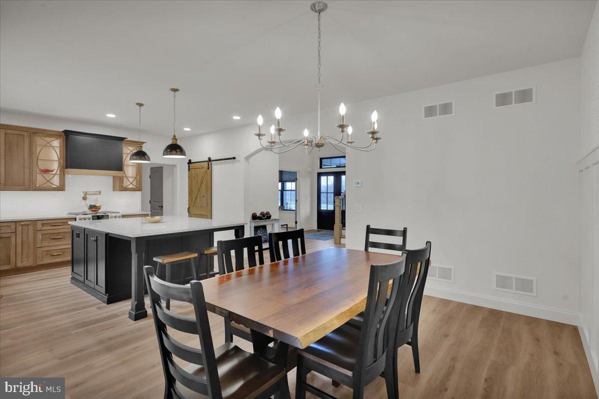 2000 Rolling Meadow Road Lebanon, PA 17046 - Photo 25 of 66 a view of a dining room with furniture and wooden floor