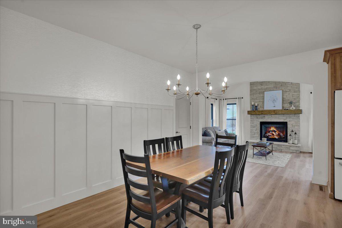 2000 Rolling Meadow Road Lebanon, PA 17046 - Photo 26 of 66 a view of a dining room with furniture a chandelier and wooden floor