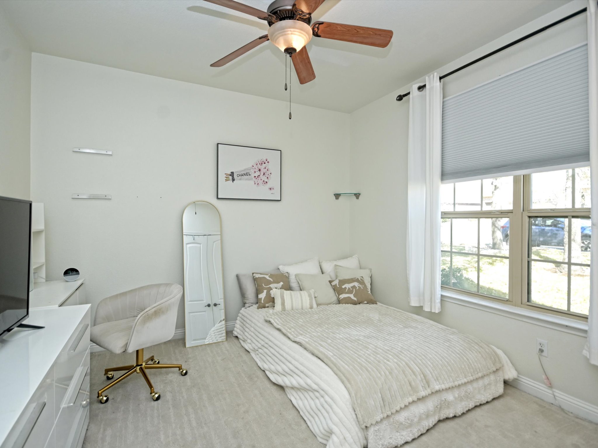 201 Bellagio Drive Austin, TX 78734 - Photo 20 of 31 One of two main floor secondary bedrooms, this room overlooks the front yard through large picture windows.