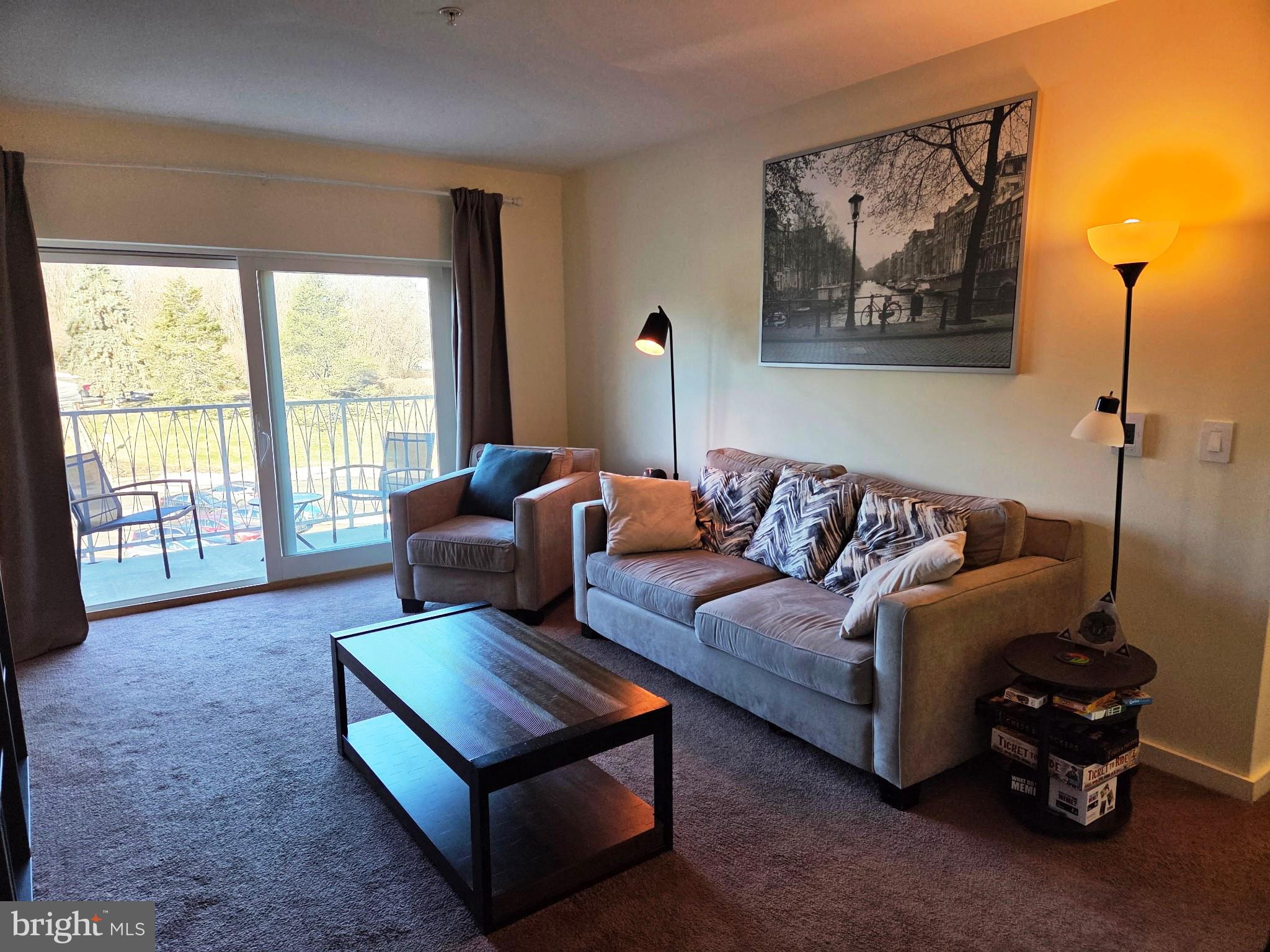 1600 Church Road, Unit B216 Wyncote, PA 19095 - Photo 3 of 11 Living Room with balcony