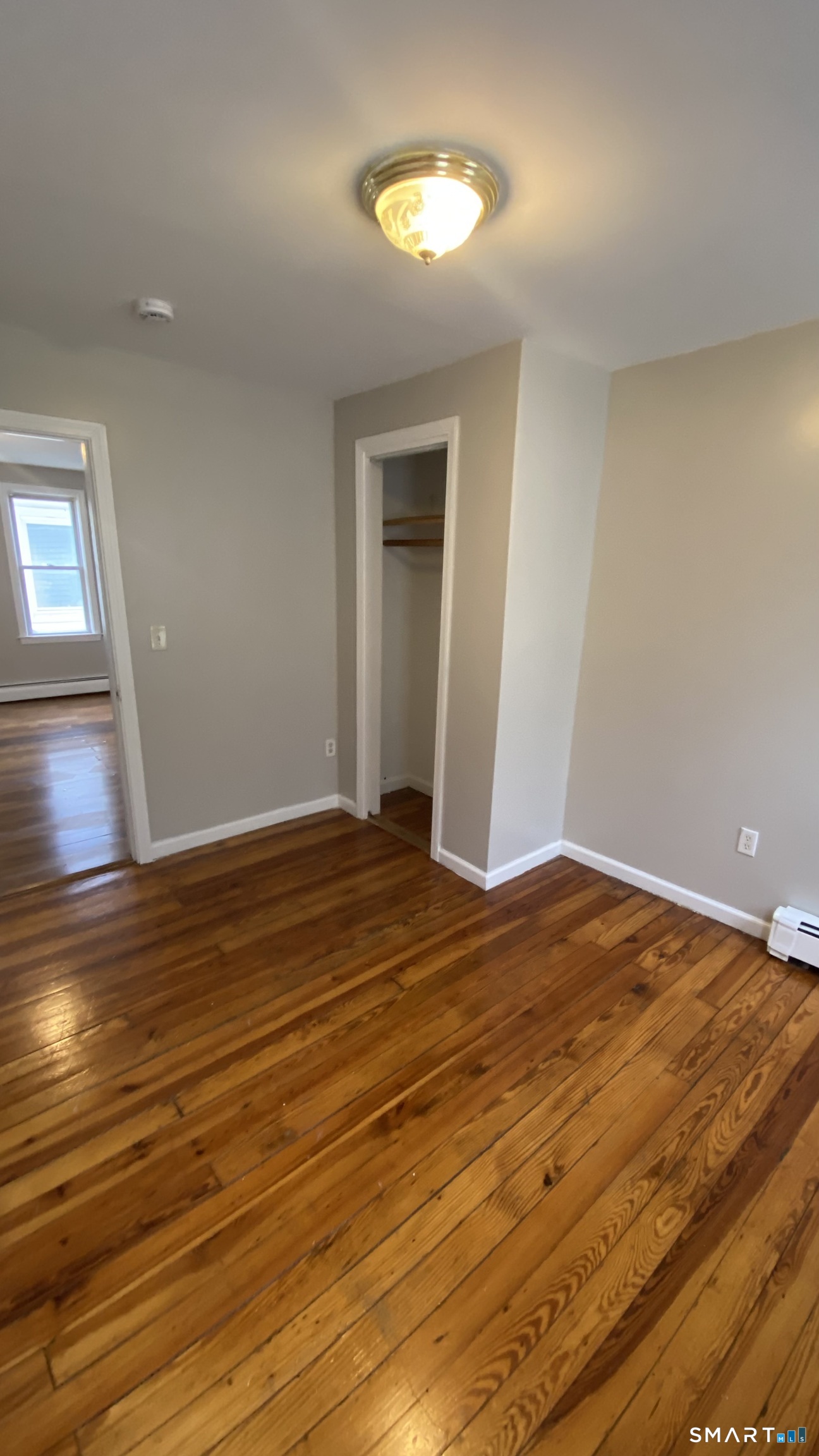 82 James Street, Unit 2 Torrington, CT 06790 - Photo 15 of 23 a view of empty room with wooden floor