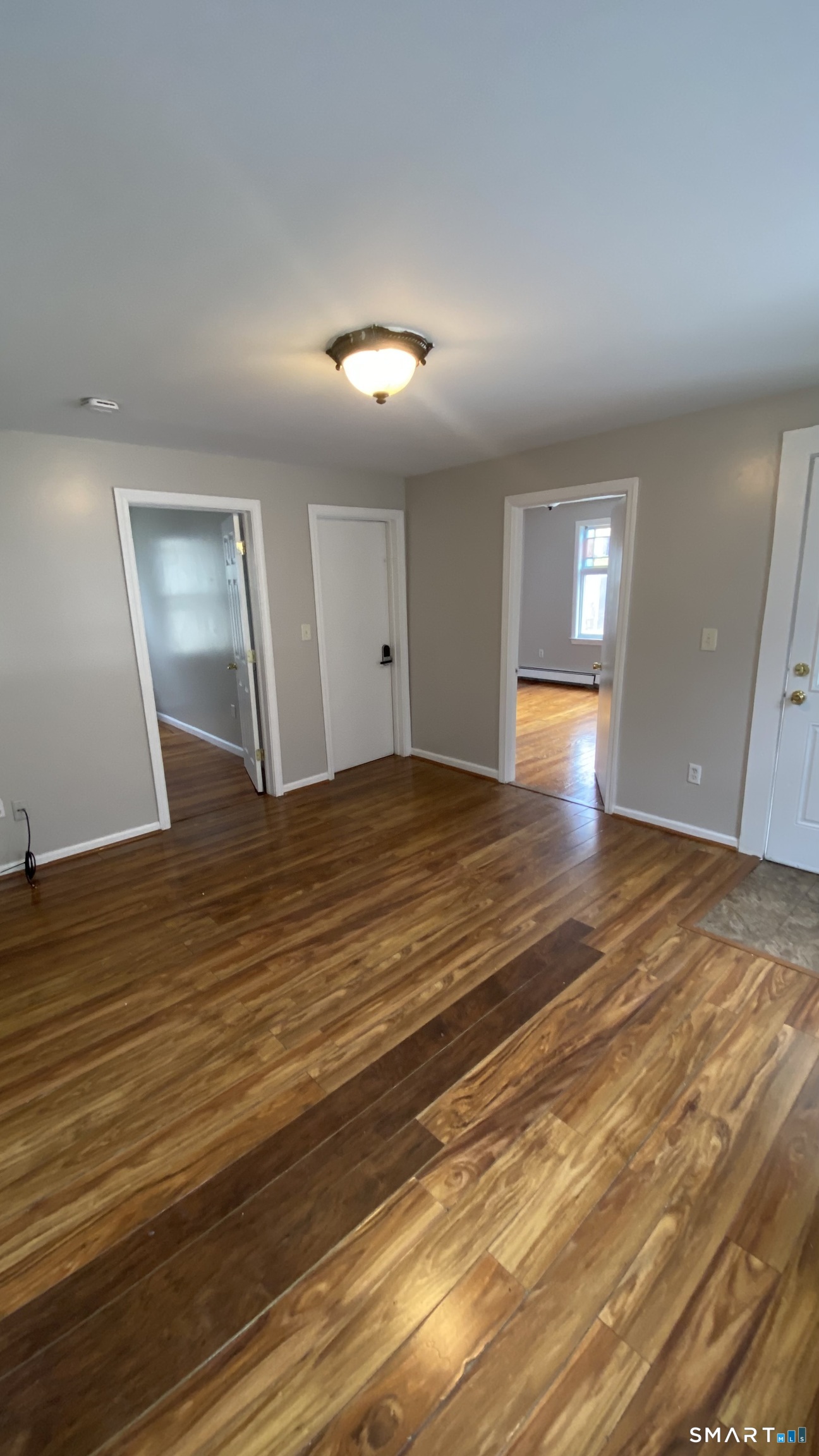 82 James Street, Unit 2 Torrington, CT 06790 - Photo 9 of 23 a view of an empty room with wooden floor