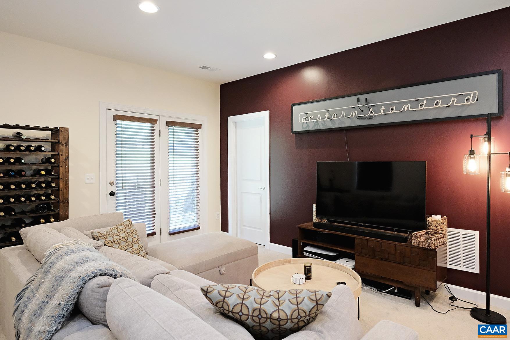 140 Junction Lane Charlottesville, VA 22902 - Photo 19 of 27 a living room with furniture and a flat screen tv