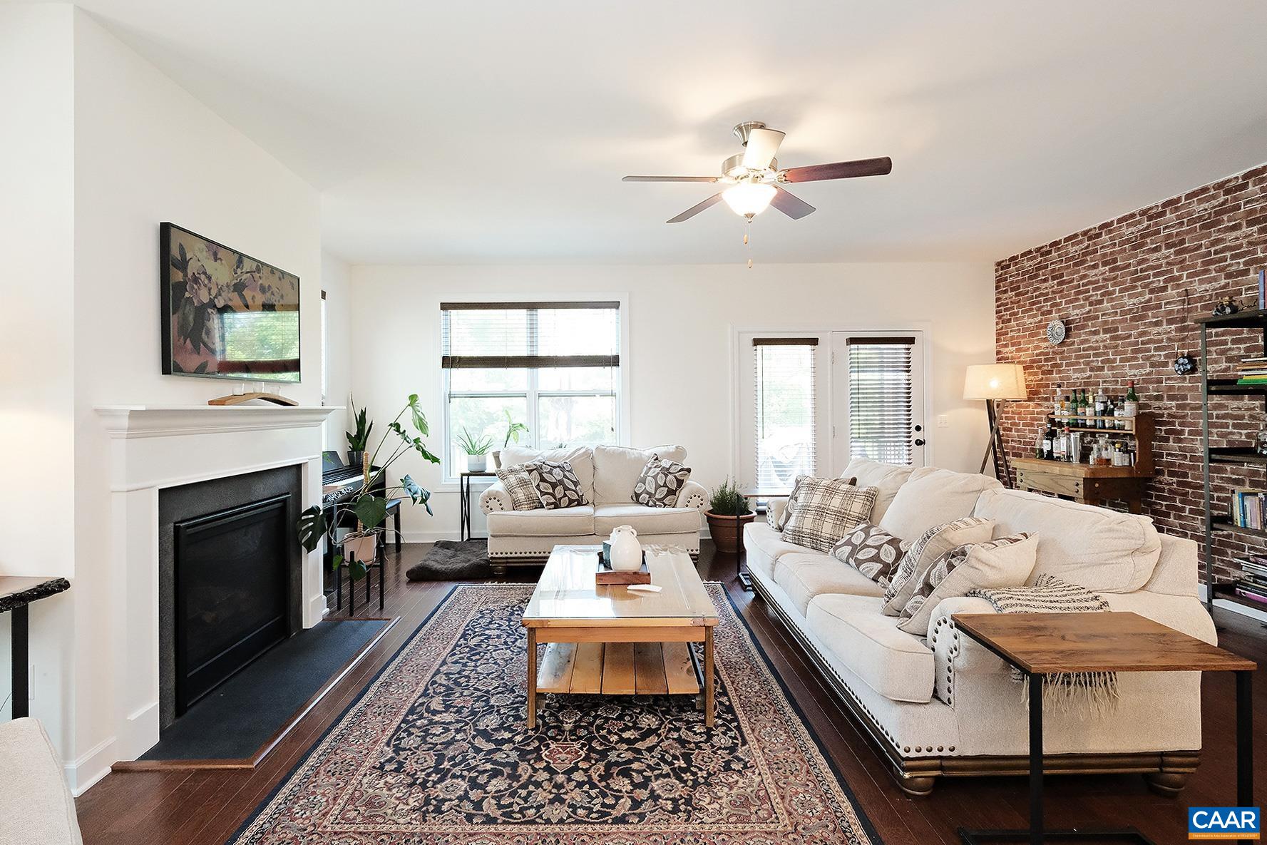 140 Junction Lane Charlottesville, VA 22902 - Photo 3 of 27 a bed room with furniture and a fireplace