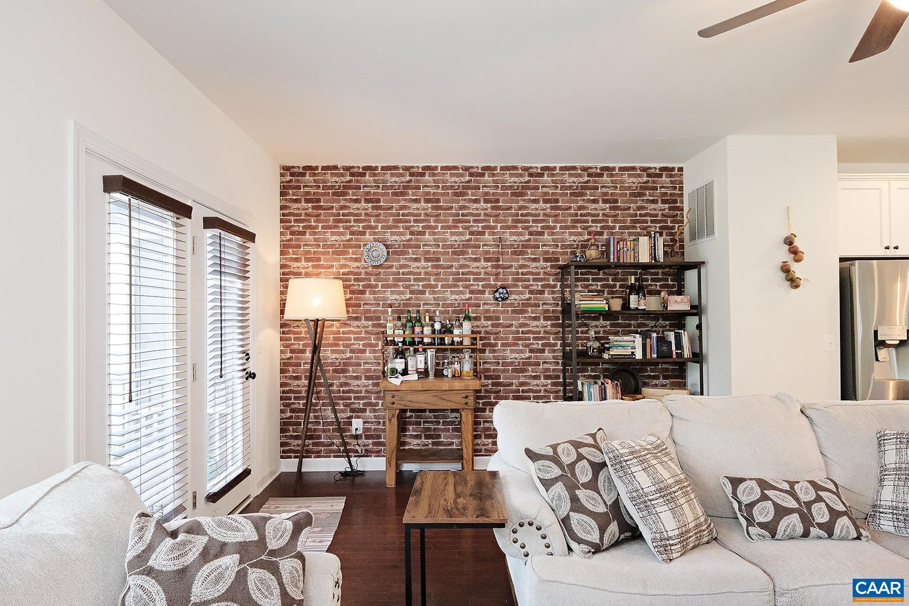140 Junction Lane Charlottesville, VA 22902 - Photo 6 of 27 a living room with furniture and a floor to ceiling window