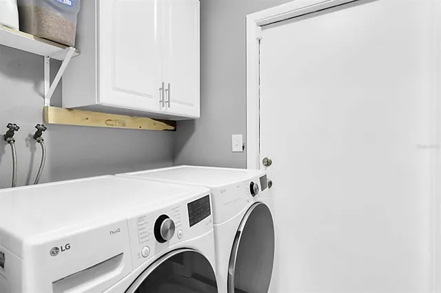 a utility room with dryer and washer