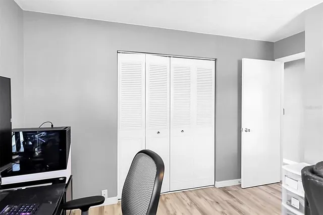 a view of room with furniture and wooden floor