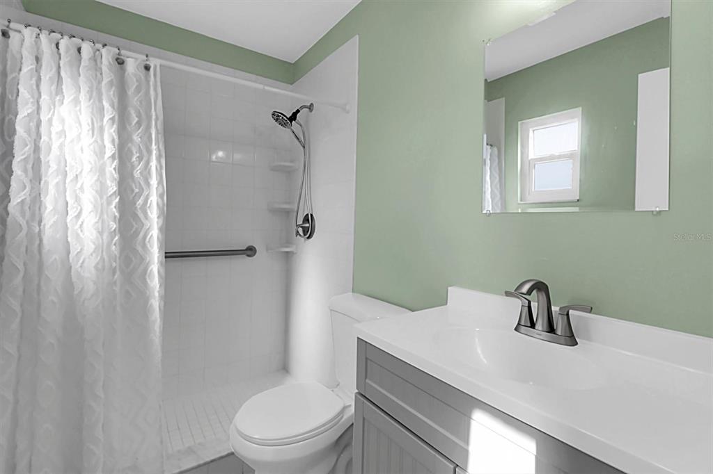 3409 Plaza Avenue Spring Hill, FL 34608 - Photo 18 of 41 a bathroom with a sink a toilet and shower