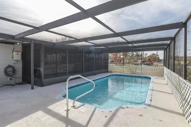 a swimming pool with view of outdoor space