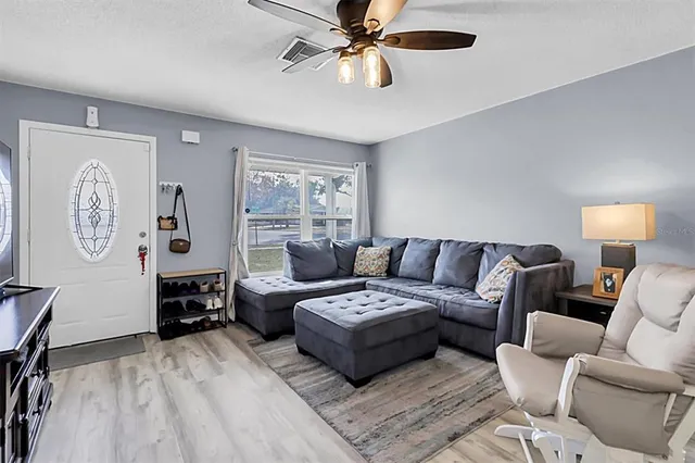 a living room with furniture and a window