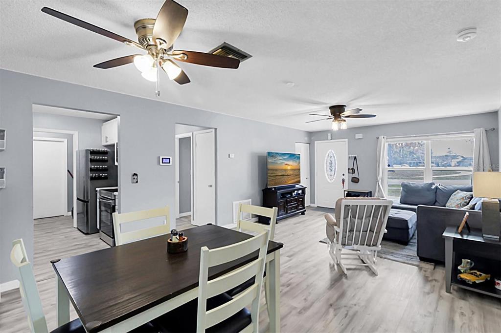 3409 Plaza Avenue Spring Hill, FL 34608 - Photo 9 of 41 a living room with furniture and a wooden floor