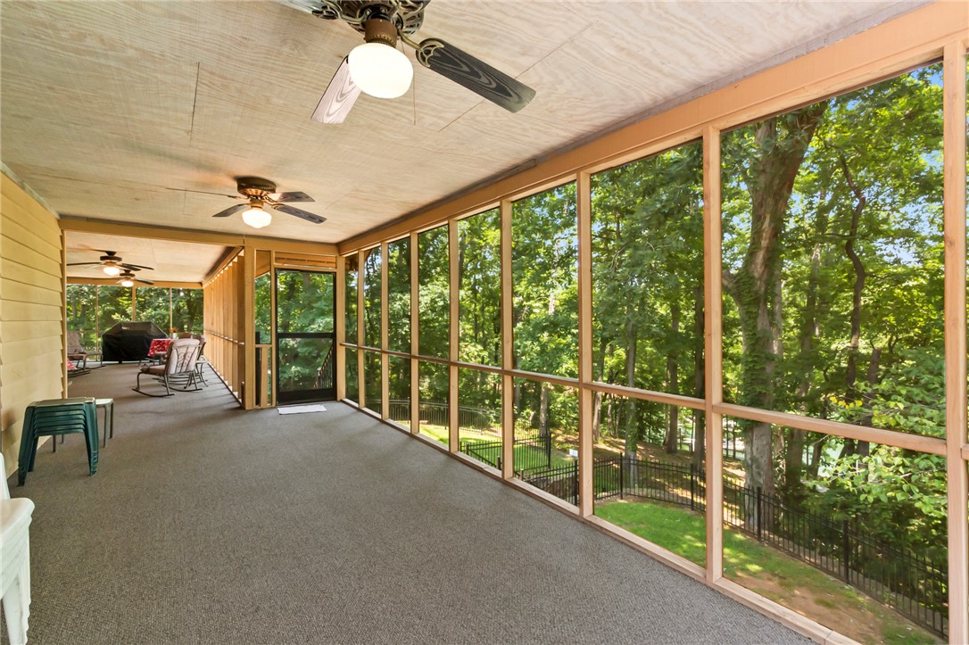 202 Plantation Point Anderson, SC 29625 - Photo 30 of 48 A tranquil screened porch offers verdant tree views for peaceful outdoor living.