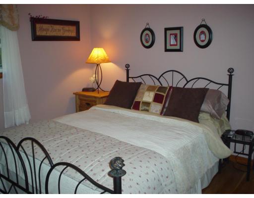 20 Cross Road Westminster, MA 01473 - Photo 7 of 14 a bedroom with a bed and a chandelier