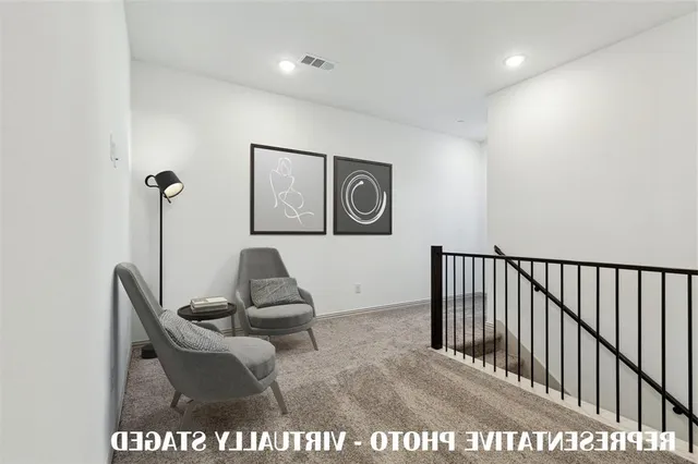 a view of a hallway with seating area