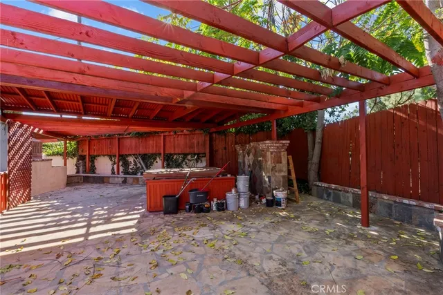 a living room with furniture and a dining table with kitchen view
