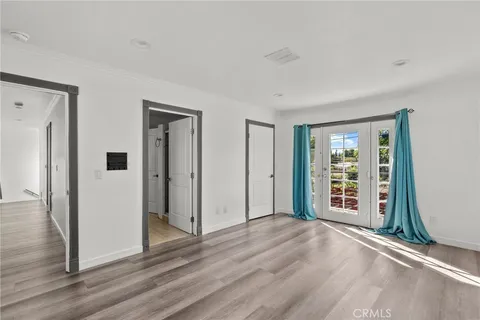 a kitchen with stainless steel appliances kitchen island granite countertop a dining table chairs and granite counter tops