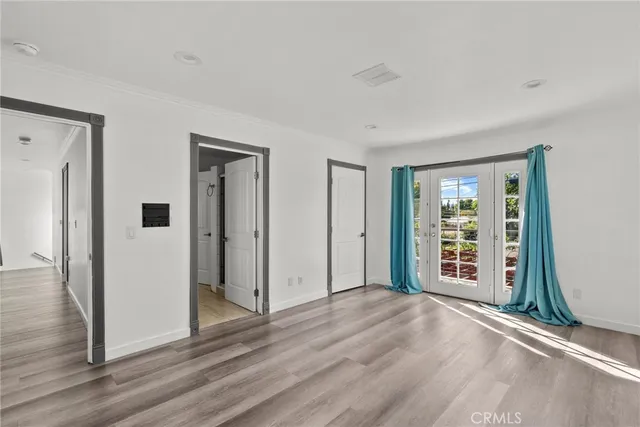 a kitchen with stainless steel appliances kitchen island granite countertop a dining table chairs and granite counter tops