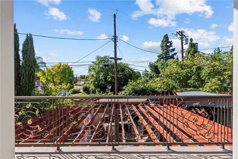 a kitchen with a sink stove and microwave