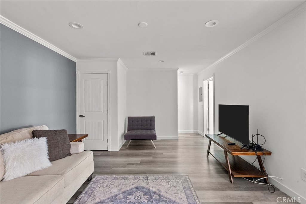 7839 Lena Avenue West Hills, CA 91304 - Photo 24 of 65 a living room with furniture and a flat screen tv