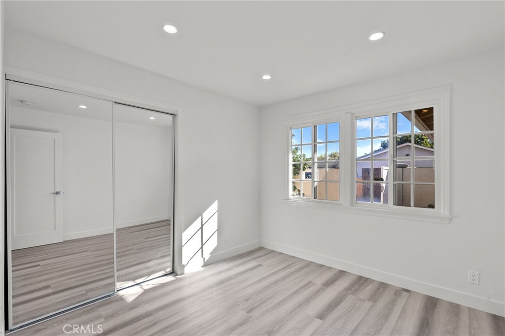 7839 Lena Avenue West Hills, CA 91304 - Photo 29 of 65 a view of an empty room with a window and wooden floor