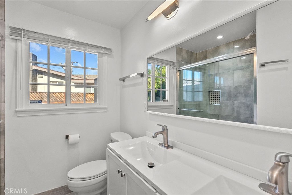 7839 Lena Avenue West Hills, CA 91304 - Photo 30 of 65 a bathroom with a sink a toilet and shower