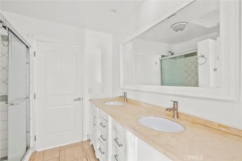 a living room with furniture a flat screen tv and a couch