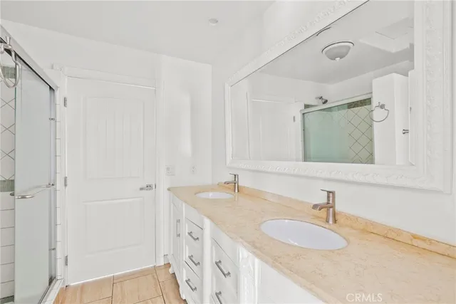 a living room with furniture a flat screen tv and a couch