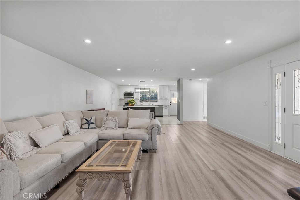 7839 Lena Avenue West Hills, CA 91304 - Photo 40 of 65 a living room with furniture and a wooden floor