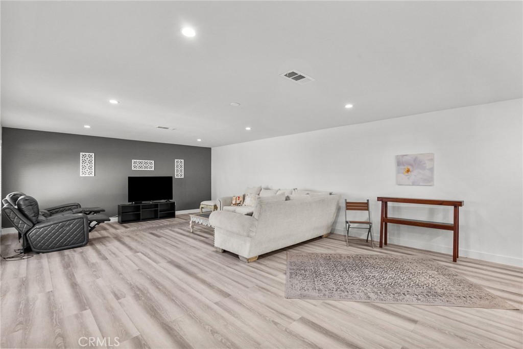 7839 Lena Avenue West Hills, CA 91304 - Photo 43 of 65 a living room with furniture and a wooden floor