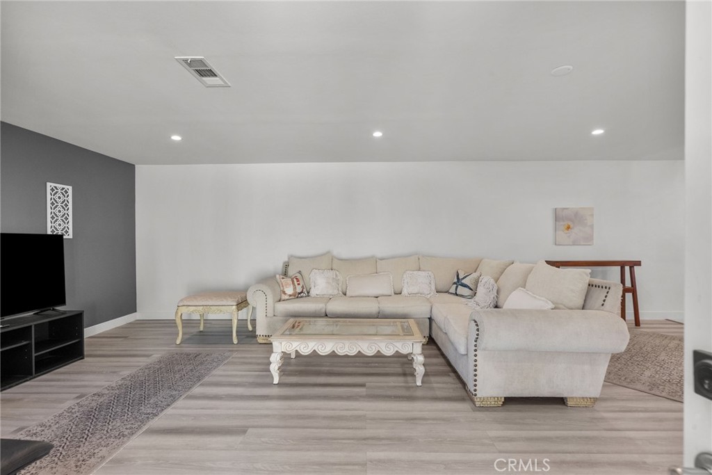 7839 Lena Avenue West Hills, CA 91304 - Photo 51 of 65 a living room with furniture and a flat screen tv