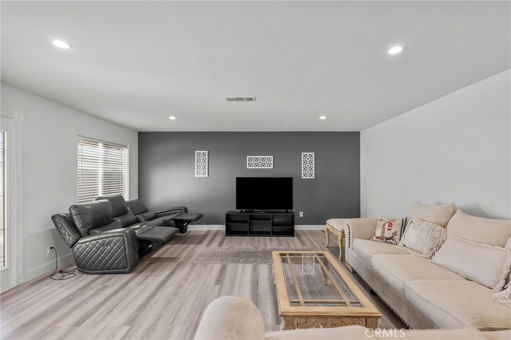 7839 Lena Avenue West Hills, CA 91304 - Photo 53 of 65 a living room with furniture and a flat screen tv