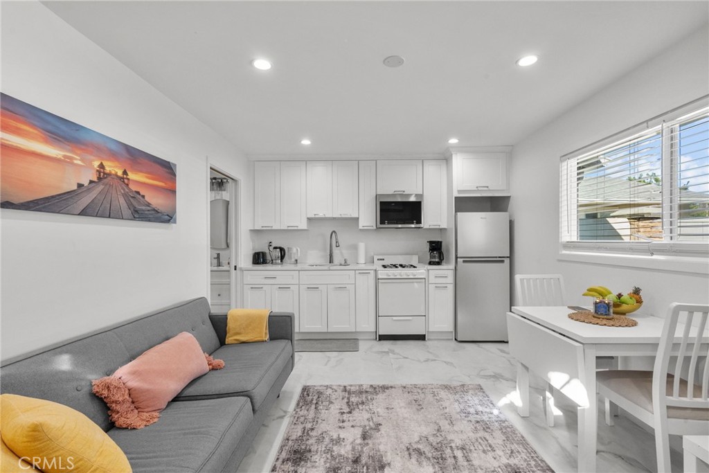 7839 Lena Avenue West Hills, CA 91304 - Photo 55 of 65 a living room with furniture appliances and kitchen view