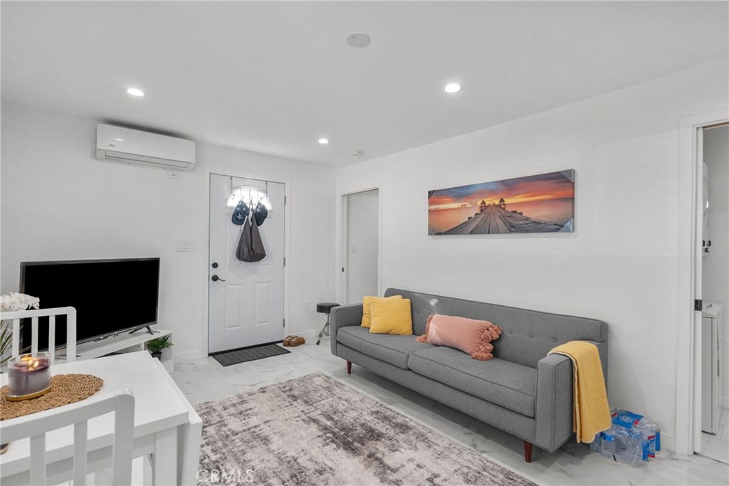 7839 Lena Avenue West Hills, CA 91304 - Photo 57 of 65 a living room with furniture and a flat screen tv