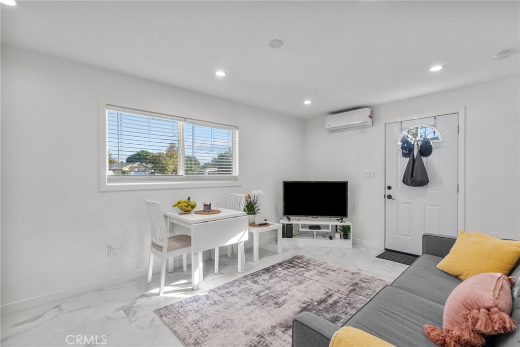 7839 Lena Avenue West Hills, CA 91304 - Photo 59 of 65 a living room with furniture and a flat screen tv