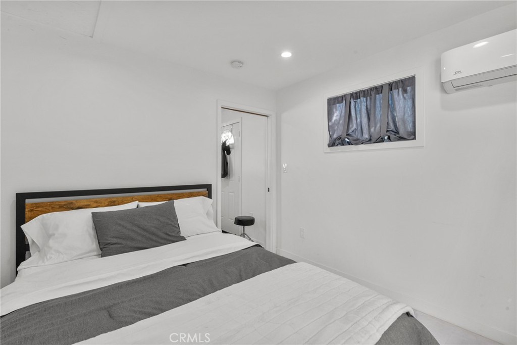 7839 Lena Avenue West Hills, CA 91304 - Photo 62 of 65 a bedroom with a bed and wooden floor