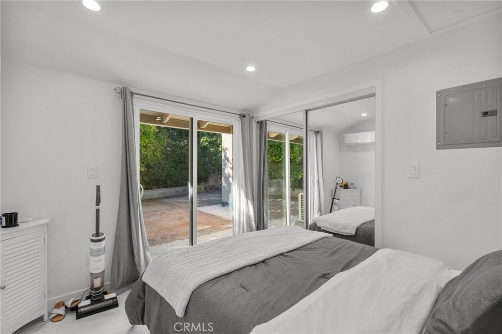 7839 Lena Avenue West Hills, CA 91304 - Photo 63 of 65 a bedroom with a bed and glass door