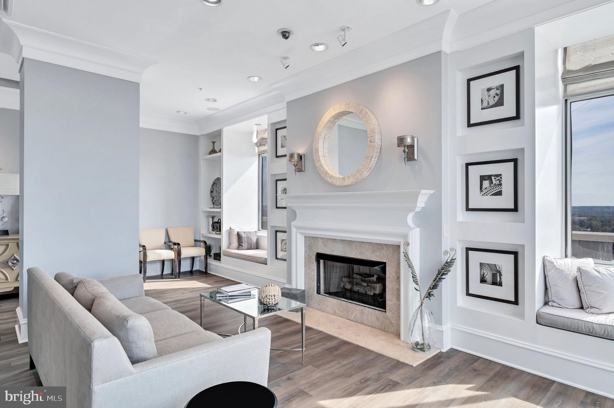 851 North Glebe Road, Unit 1712 Arlington, VA 22203 - Photo 13 of 25 a living room with furniture a fireplace and a painting