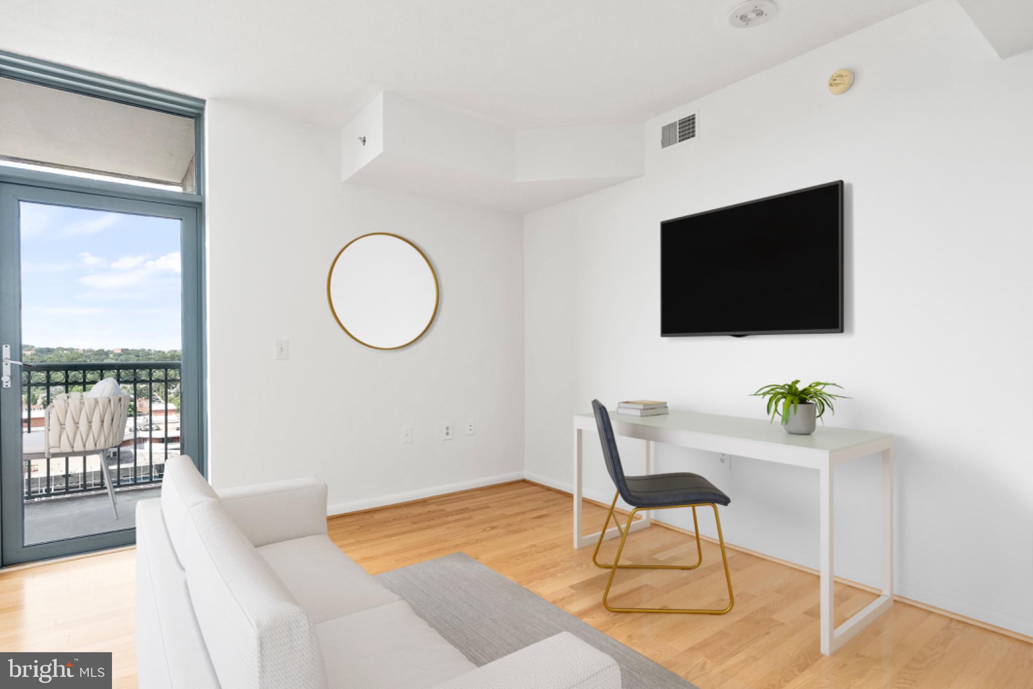 851 North Glebe Road, Unit 1712 Arlington, VA 22203 - Photo 2 of 25 a living room with furniture and a flat screen tv