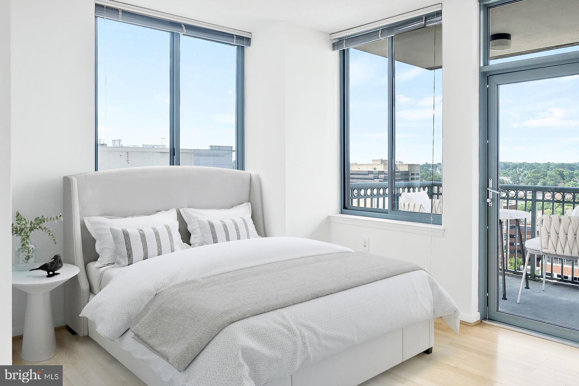 851 North Glebe Road, Unit 1712 Arlington, VA 22203 - Photo 8 of 25 a bedroom with a large bed and a large window