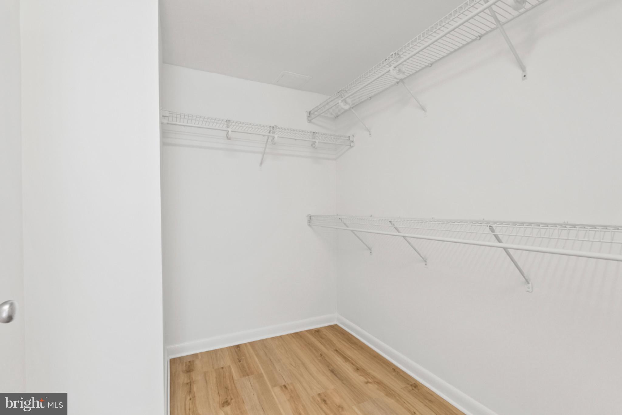 851 North Glebe Road, Unit 1712 Arlington, VA 22203 - Photo 9 of 25 a view of a room with racks on the wall
