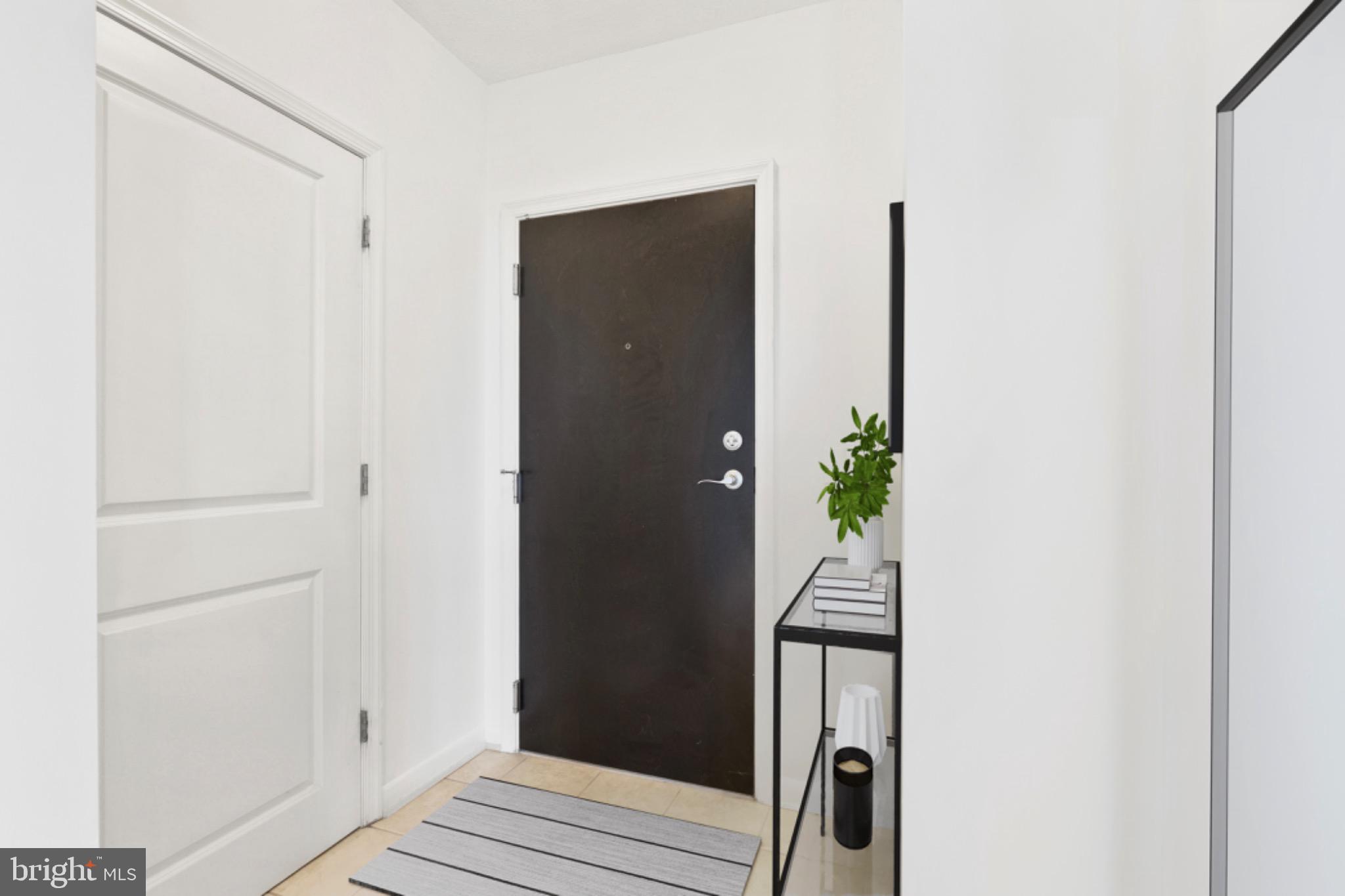 851 North Glebe Road, Unit 1712 Arlington, VA 22203 - Photo 10 of 25 a view of a hallway with wooden floor and stairs
