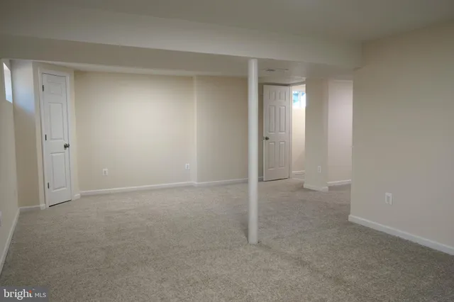 an empty room with a bathroom