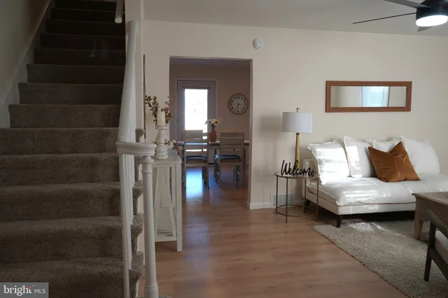 a bedroom with furniture and wooden floor