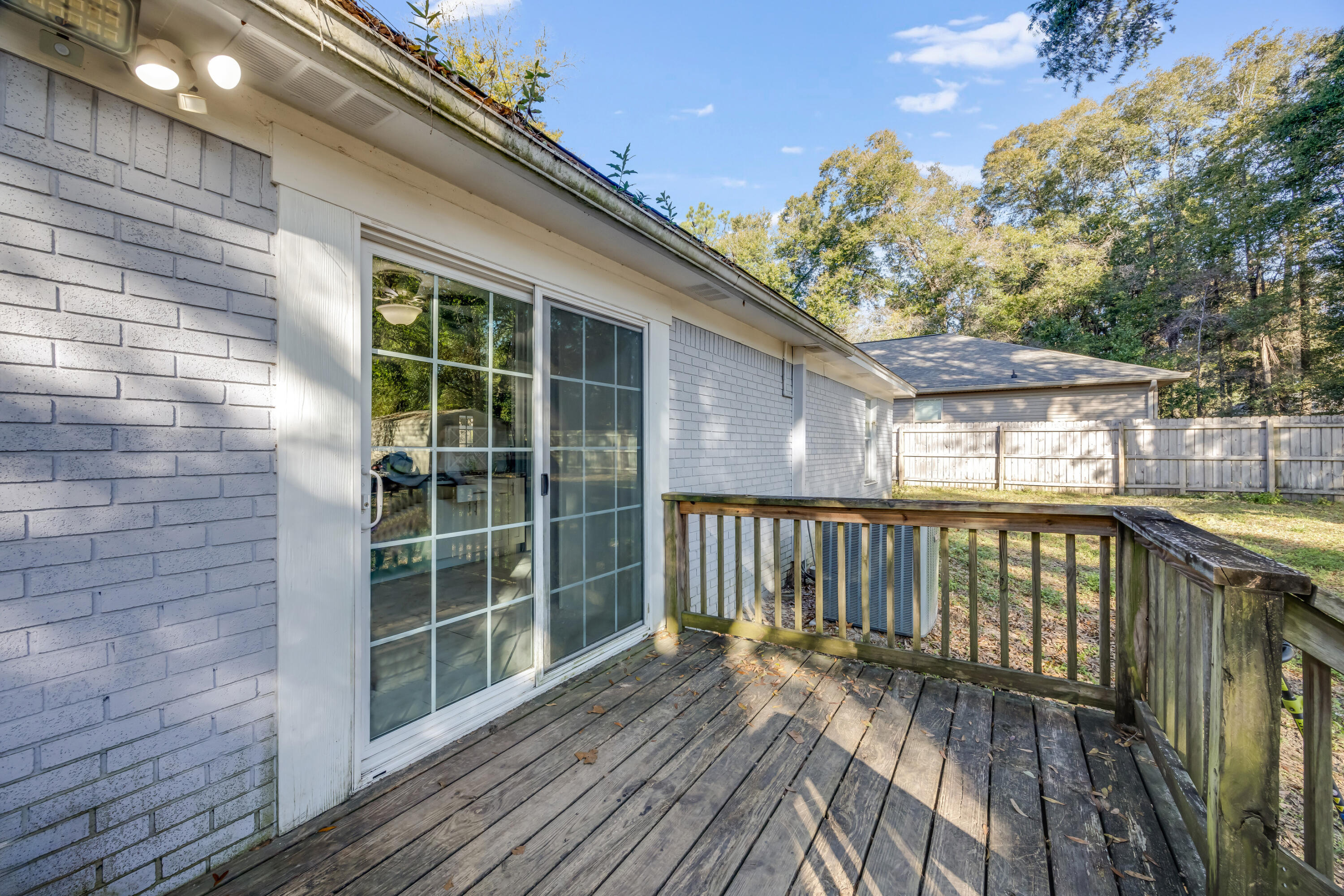 966 Valley Road Crestview, FL 32539 - Photo 21 of 32 a view of balcony with wooden floor and fence and a potted plant