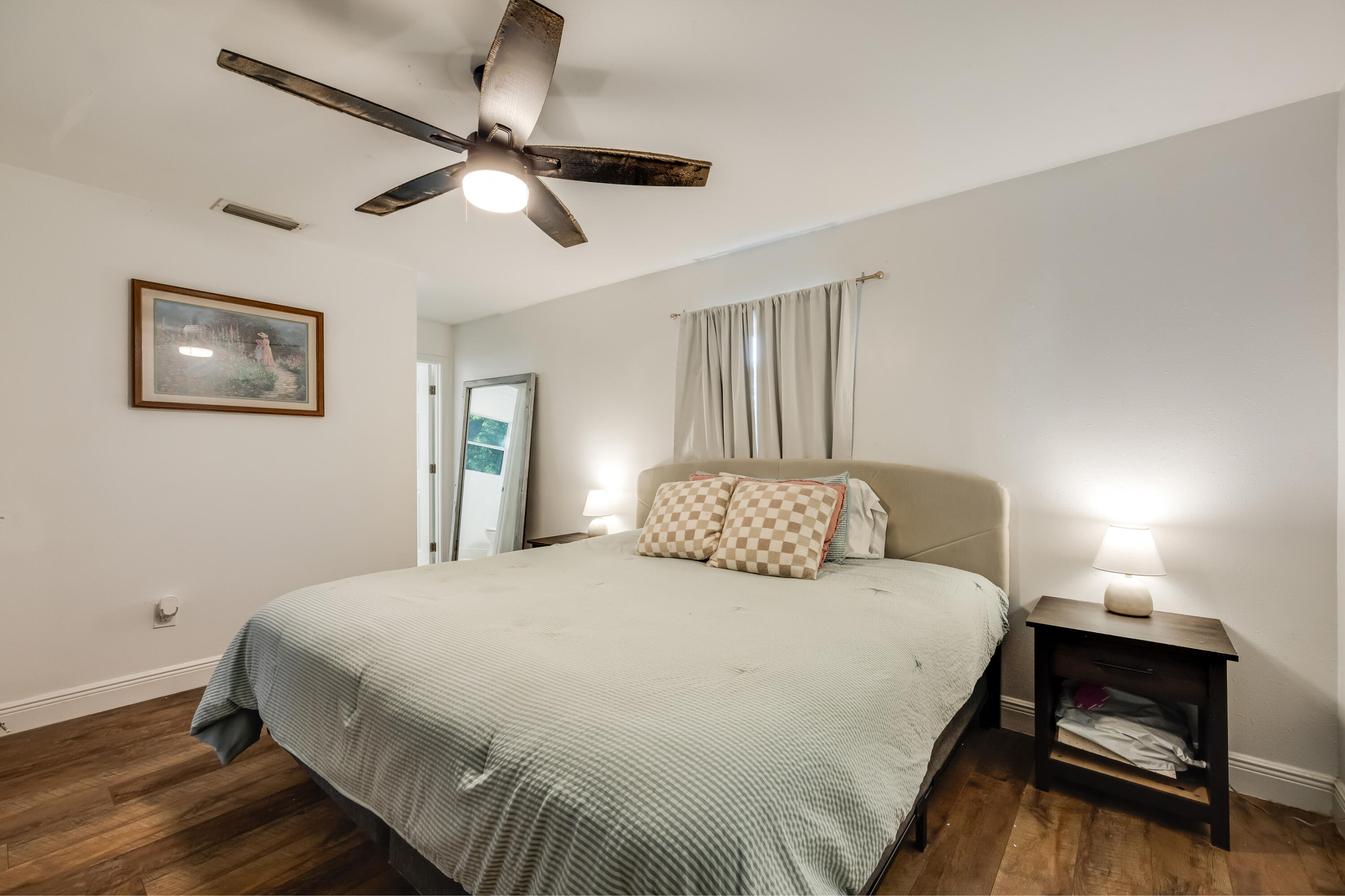 966 Valley Road Crestview, FL 32539 - Photo 24 of 32 a bedroom with a bed and a chandelier