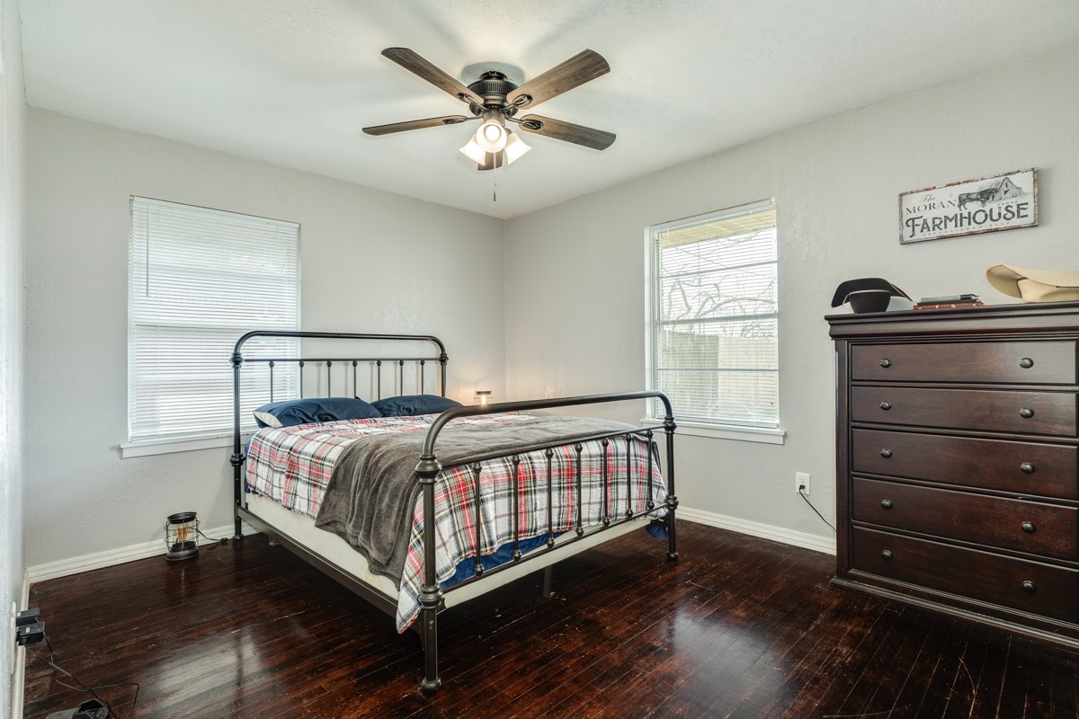 2109 North Tinsley Street Angleton, TX 77515 - Photo 22 of 27 a bedroom with a bed and a window